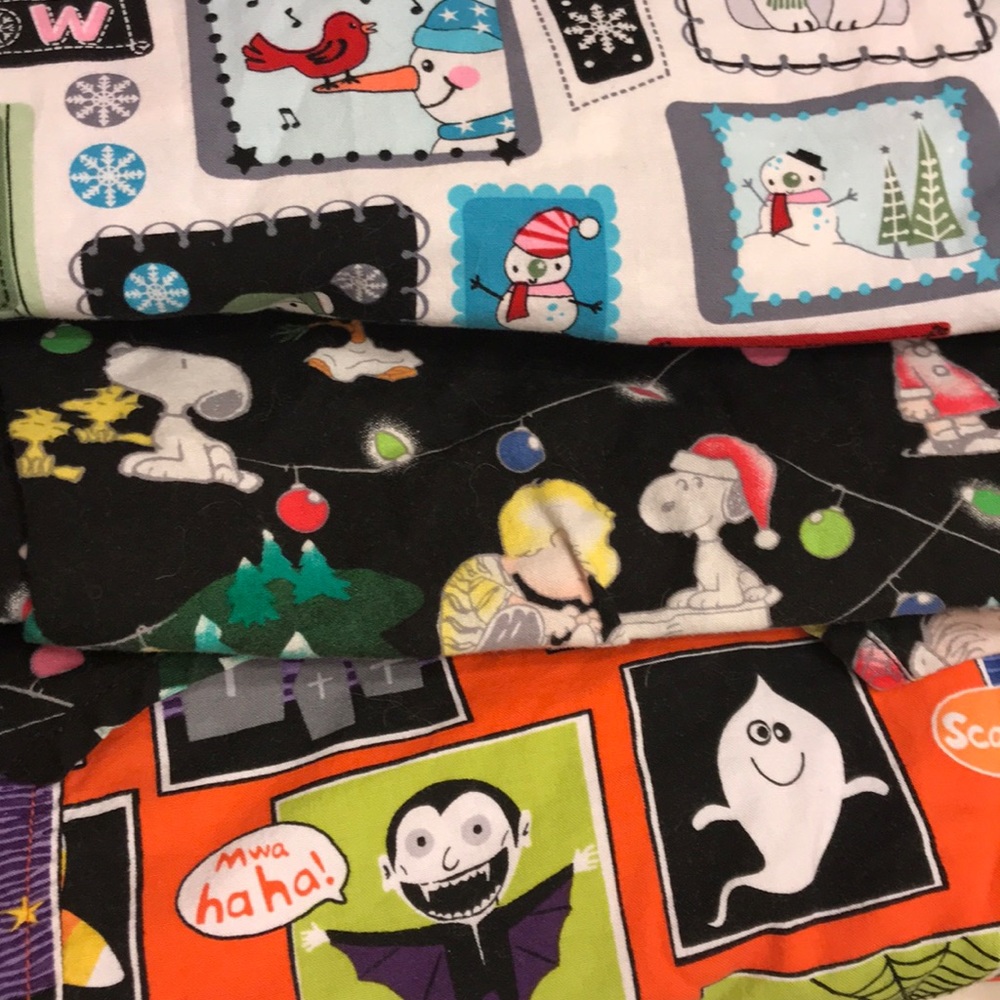 Three holiday scrub tops